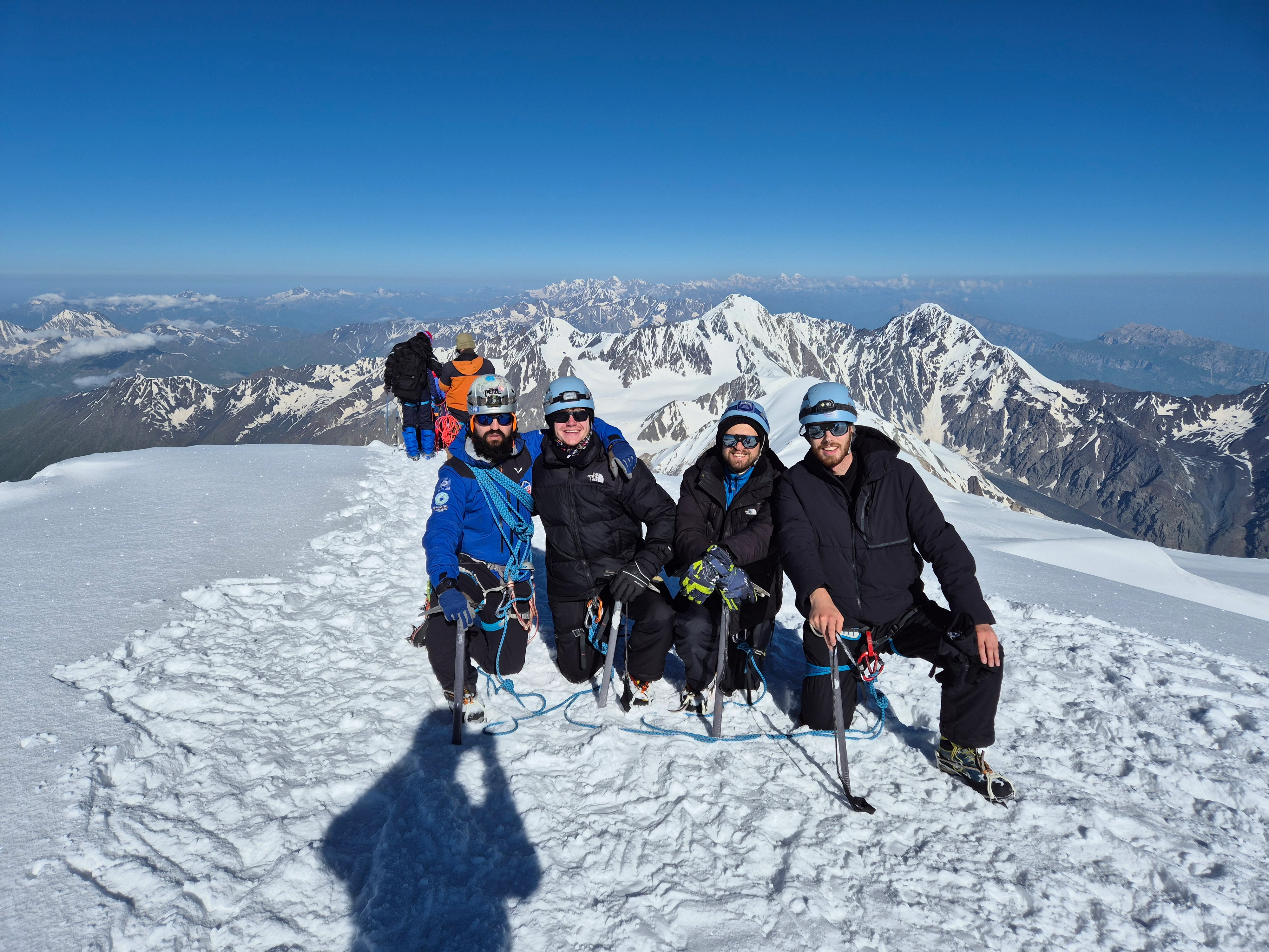 Mountaineers on a snowy Mount Kazbek ridge